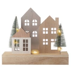 Lit house scene with woodland trees on base