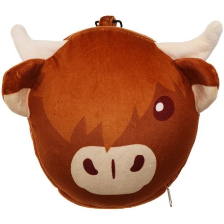 A  travel pillow and eye mask in a animated highland cow design