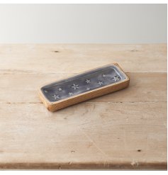 This Mango Wood tray plate with embossed stars adds a unique and modern touch to your kitchen or dining room