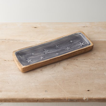 A beautiful dark grey glazed wooden tray with embossed stars.