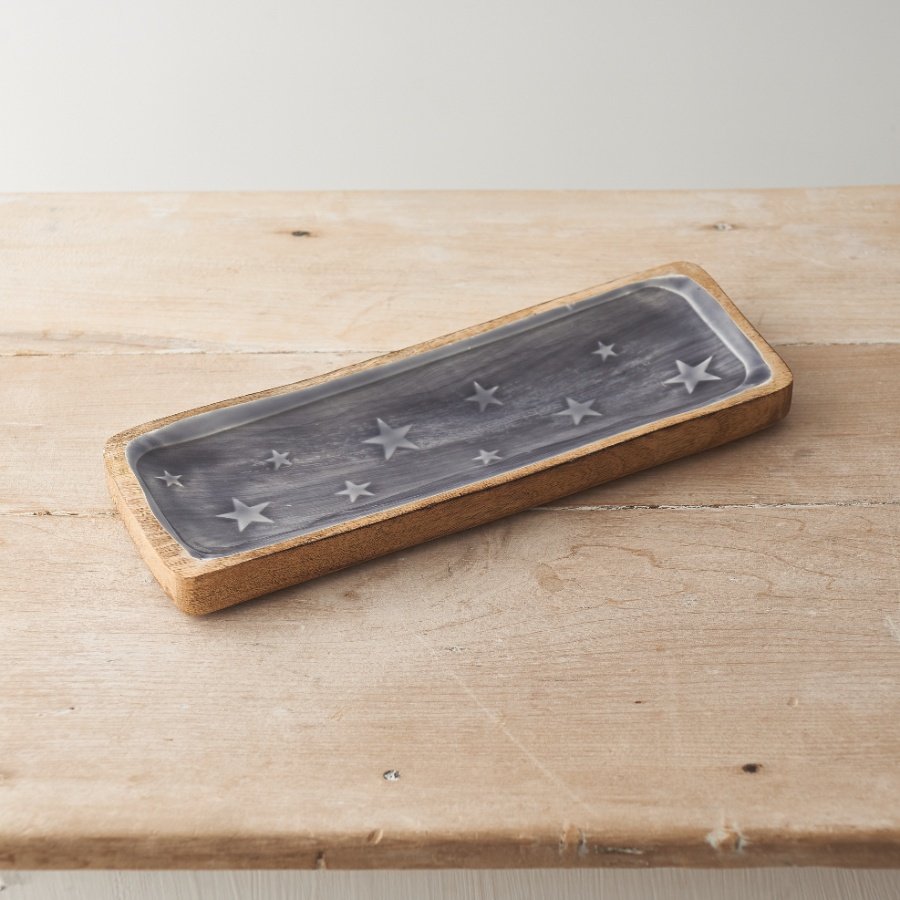 A beautiful dark grey glazed wooden tray with embossed stars.