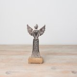 A beautiful aluminium angel decoration with 3d star details on a contrasting wooden base. 