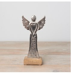 A stylish aluminium angel with 3D star detailing on a contrasting wooden base. 