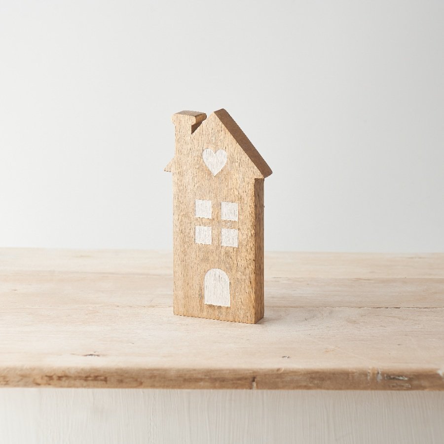 A sweet house decoration made from mango wood with contrasting window details and heart motif. 