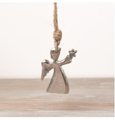 A metal hanging angel decoration hung from jute string. 