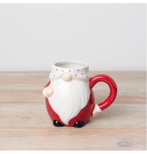 An adorable gonk ceramic mug with Santa inspired design and a ditsy polka dot pattern. 