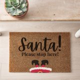 A coir doormat with "Santa please stop here" message, perfect for the festive season!