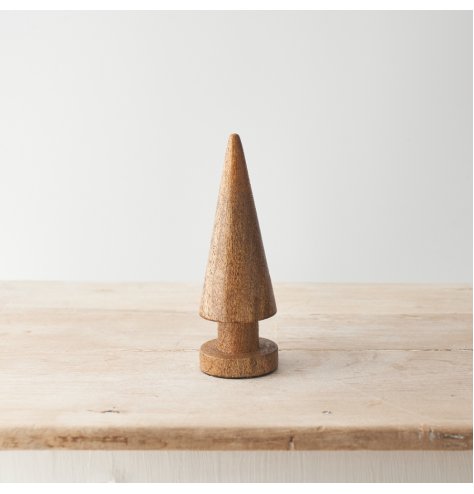 A modern Christmas tree sculpted from natural mango wood. With visible wood grain and a smooth finish.