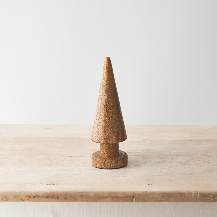 A minimal Christmas tree sculpted from natural mango wood. In a rich earthy tone this contemporary tree will add texture