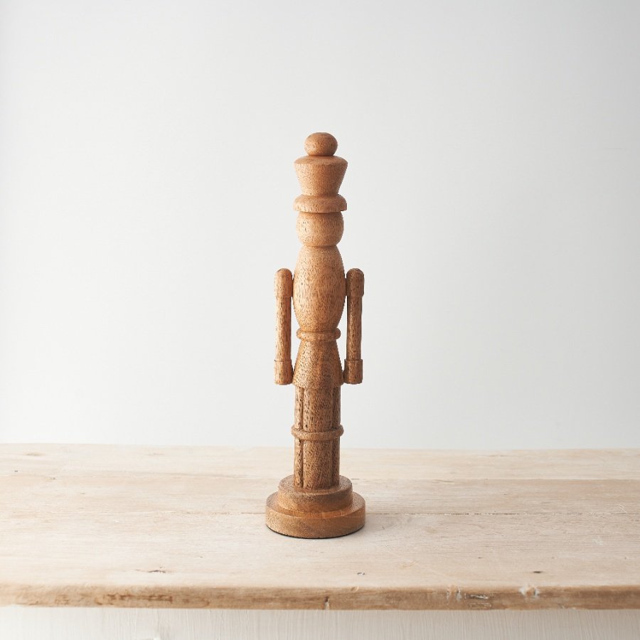 A minimal yet striking wooden nutcracker decoration. 