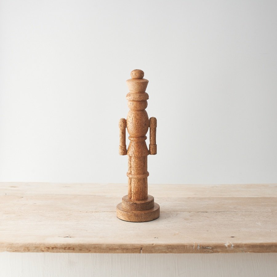 A contemporary twist on a Christmas classic. This stunning nutcracker has been carved from natural mango wood. 