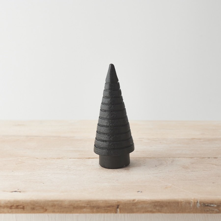 This sculptural, modern Christmas tree is a must have seasonal decoration. Made from chunky mango wood with a raw finish