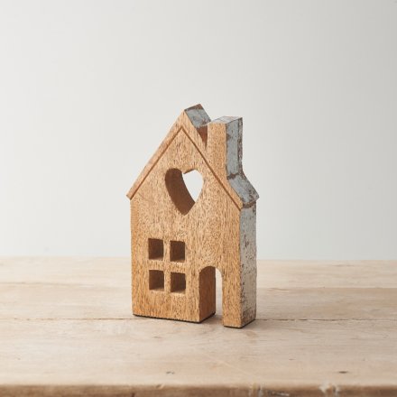 A chunky house ornament made from natural mango wood. With a smooth finish and rustic wood grain