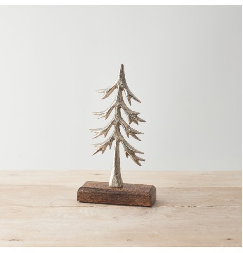 A charming rustic tree ornament. A silver hammered tree with a chunky base made from mango wood. 