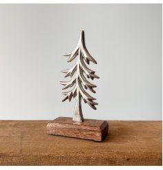 A stylish tree ornament with a hammered surface and chunky mango wood base. 
