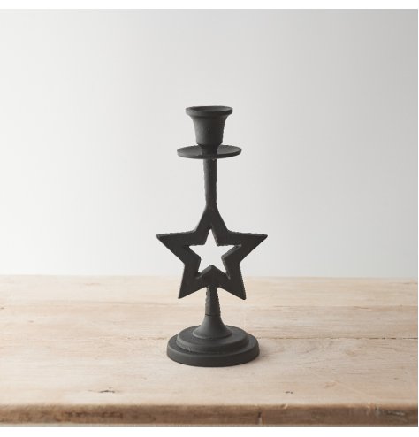 A stylish black candle holder with a hammered finish a star feature. 