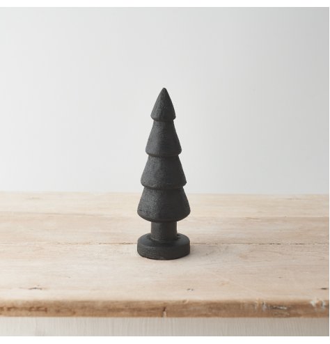 A chunky carved Christmas tree made from natural mango wood. With a distressed, black finish.