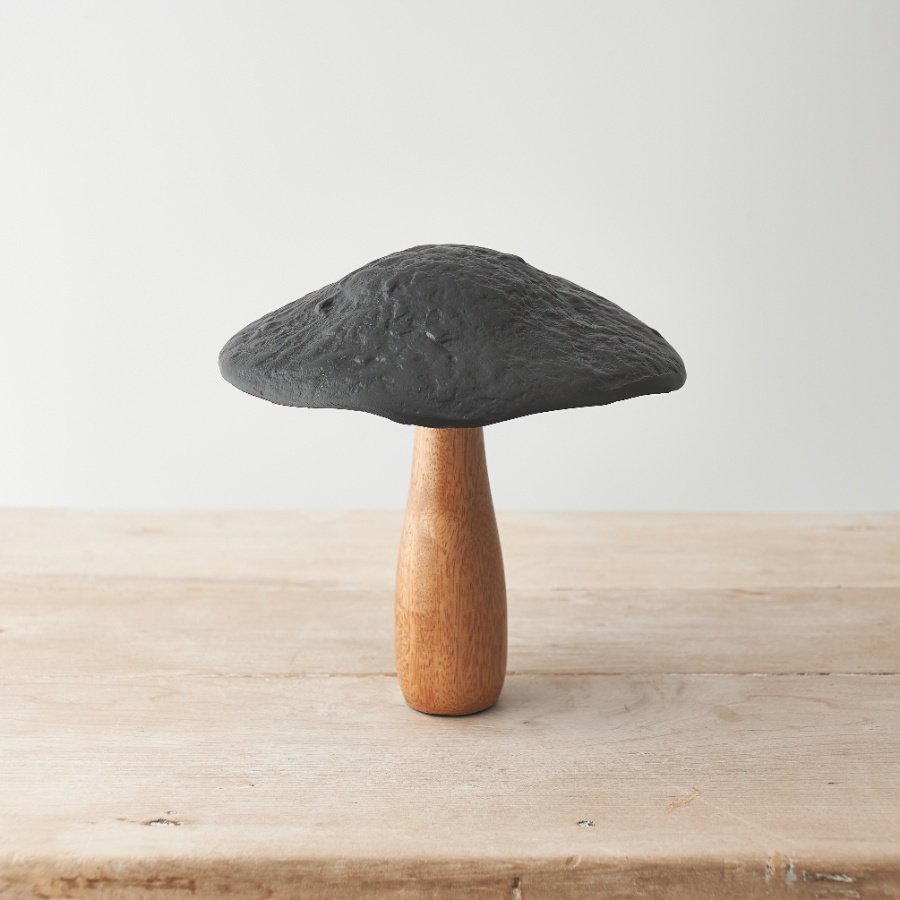 A unique ornament for the home. Crafted from natural mango wood with a stylish black metal cap. 