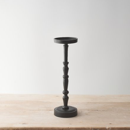 A solid candle holder with a matt black finish.  An elegant interior accessory for displaying your pillar candles. 