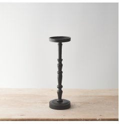 An elegant candle holder made from raw aluminium with a matt black finish. 