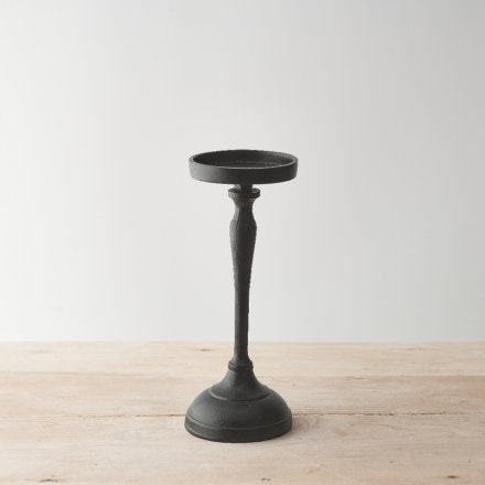 A chic pillar candle holder made from raw aluminium with a matt black coating. 