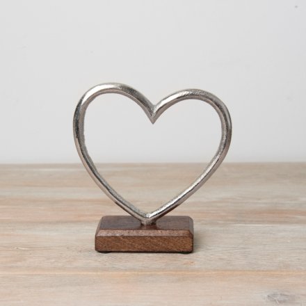 Rustic metal heart on a wooden base