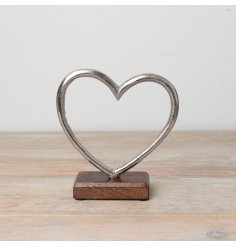 Rustic metal heart on a wooden base