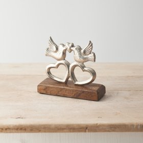 A stylish ornament featuring love birds and hearts. Made from hammered silver with a sustainable mango wood base. 