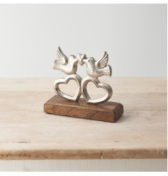 A charming ornament featuring two love birds with hearts set upon a chunky mango wood base. 