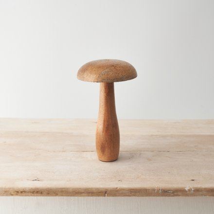 A chic wooden mushroom ornament crafted from natural mango wood. With a smooth finish and natural wood grain. 