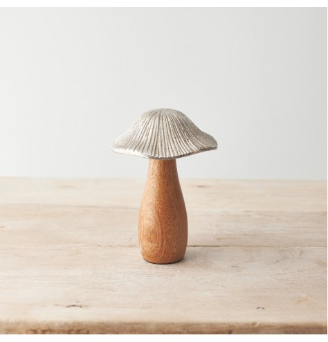 Bring the outdoors in with this woodland inspired mushroom ornament made from hammered metal and natural mango wood. 