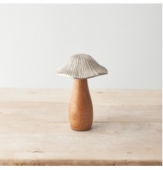 A beautifully crafted mushroom ornament with a chunky mango wood base and hammered metal cap. 
