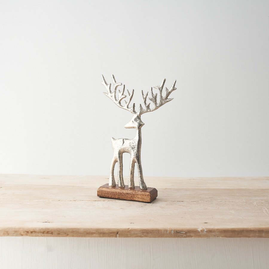 Single silver reindeer stood on a contrasting base