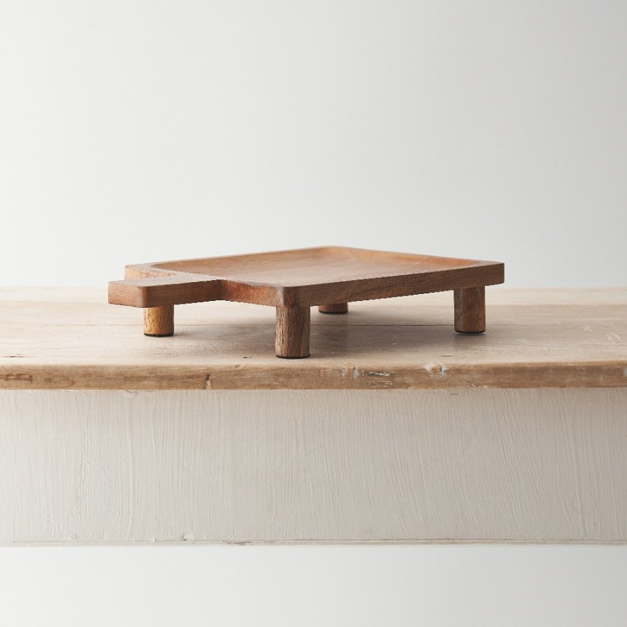 Crafted from mango wood this display tray has a warm and natural aesthetic. 