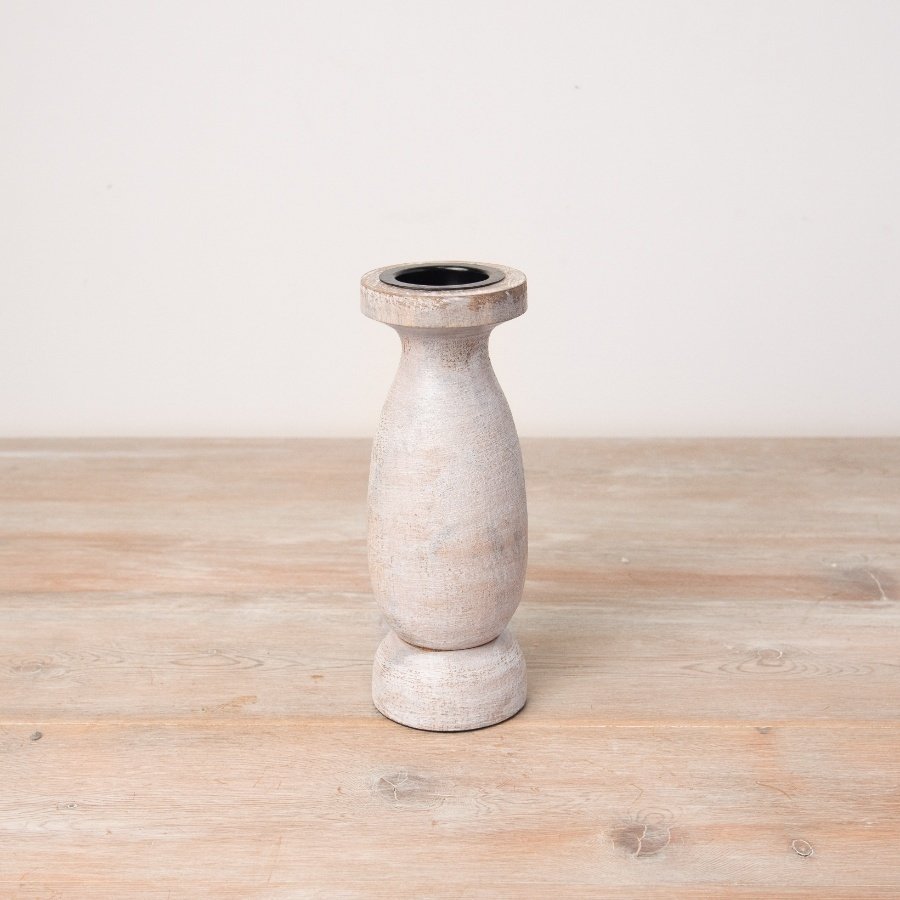 A rustic wooden candle holder. Elegant and simple with a washed finish. 