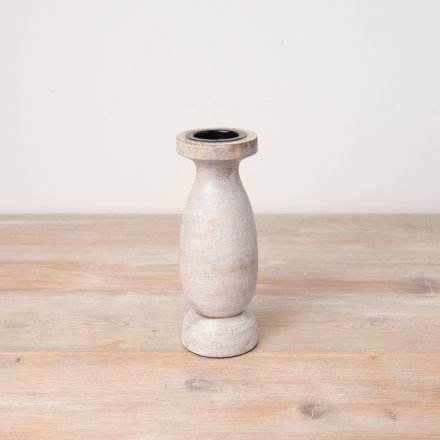 A stylish wooden pillar candle holder with a natural, white washed finish. 