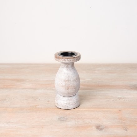 A stylish wooden pillar candle holder with a natural, white washed finish. 