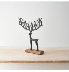 A stylish and sculptural item featuring a reindeer with exaggerated antlers in a painted black finish.