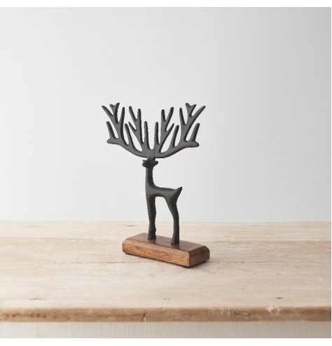 A stylish and sculptural item featuring a reindeer with exaggerated antlers in a painted black finish.