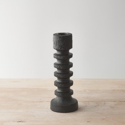 A black painted finish wooden candle pillar with a chic minimalist design. A sculptural item which would add style.