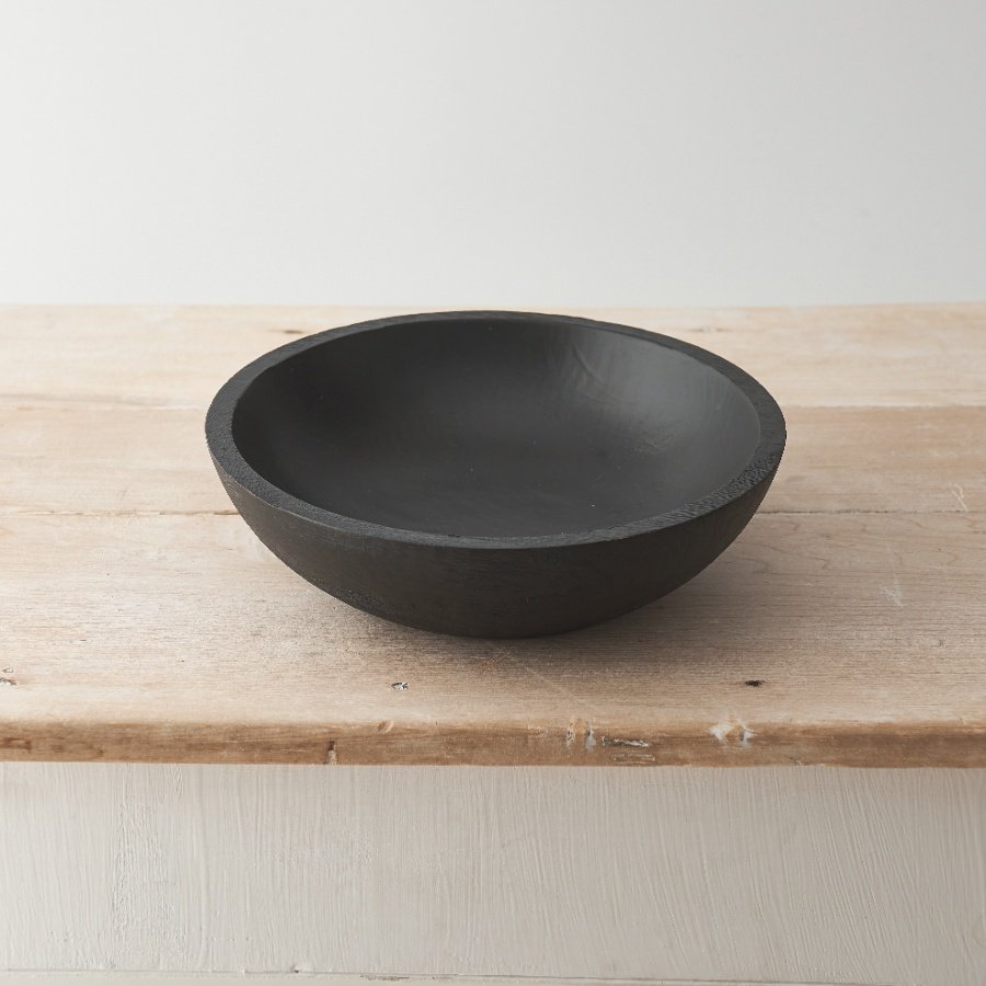 Crafted from natural mango wood with a black finish this sculptural and functional dish is a must have accessory 