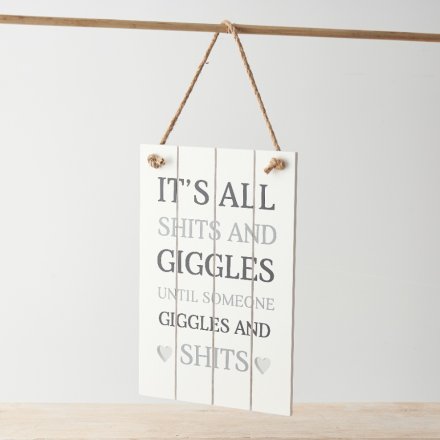 A slatted wooden sign with heart detailing and fun "it's all shits and giggles until someone giggles and shits" message!