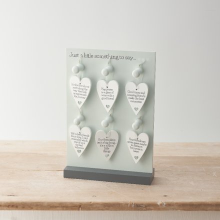 An assortment of 6 heart signs all with friendship quotes displayed on them