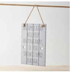 A small wooden plaque printed with a comical scripted text decal