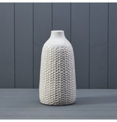 A stylish ceramic vase with a textured leaf pattern. A beautiful vessel