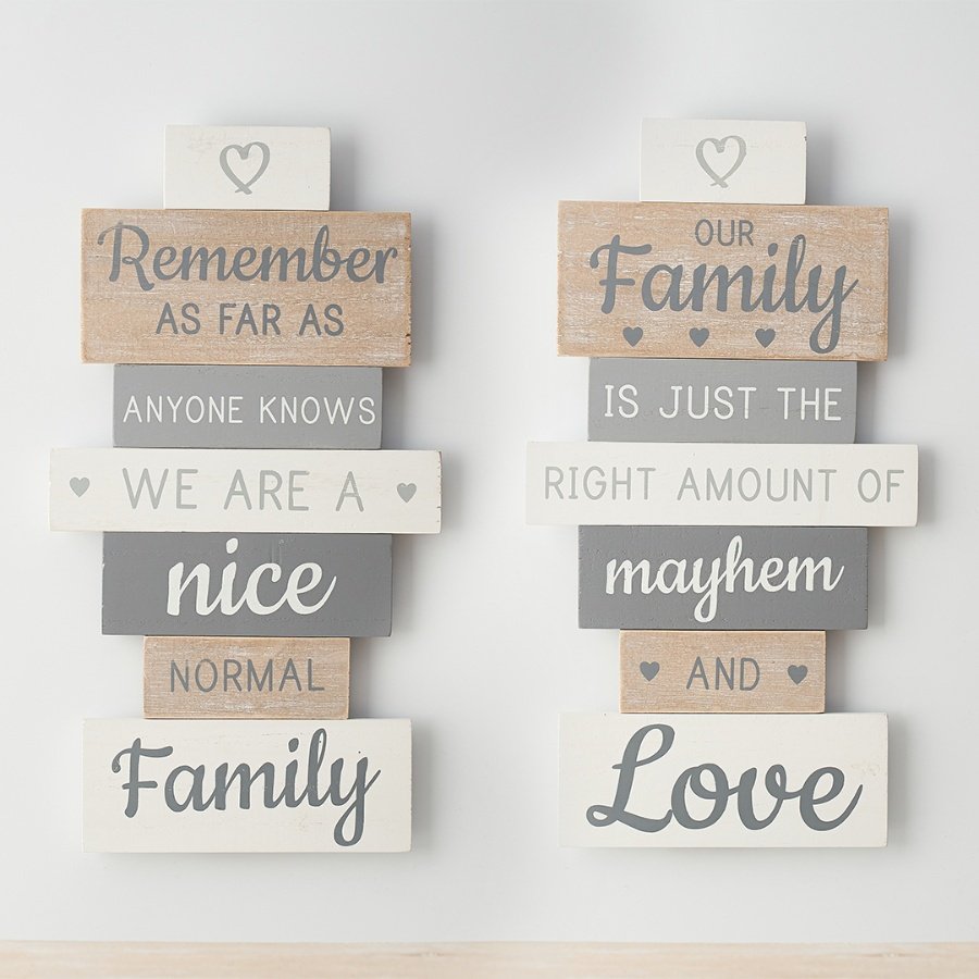 2 Assorted wooden signs each in neutral tones with a fun quote about families and cute heart details. 