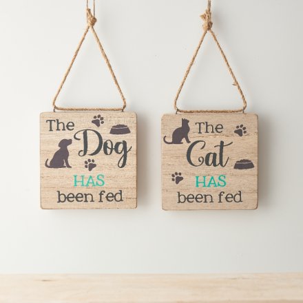 A reversible wooden hanging sign with "the cat/dog has/ has not been fed" wording and paw print details. 