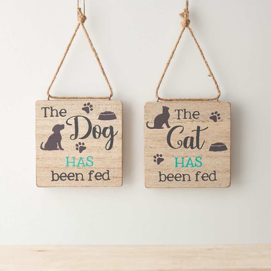 A two sided wooden sign with "the cat/dog has/ has not been fed" message and paw print design. 