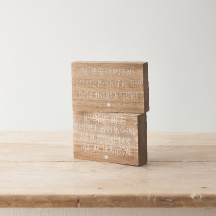 An assortment of two wooden blocks each with a heart warming quote and heart detail. 