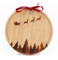 A beautifully crafted round board with a red ribbon bow. Detailed with a flying sleigh, magic dust and a forest scene.
